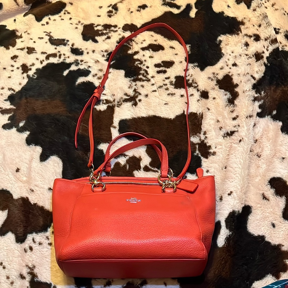 Orange Coach bag with small body strap